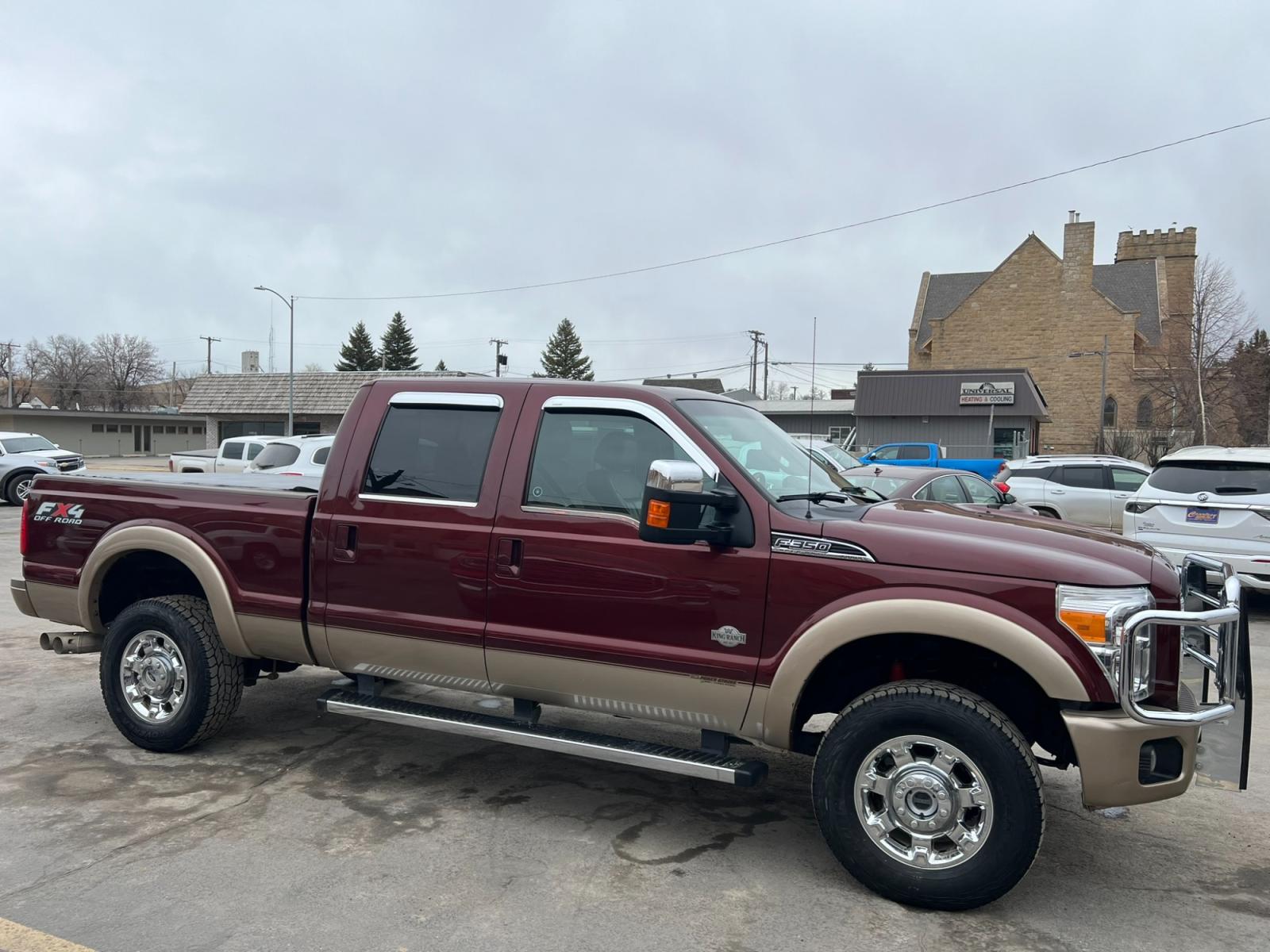 2012 Maroon /Brown Ford F-350 SD King Ranch (1FT8W3BT7CE) with an 6.7L V8 F OHV 32V DIESEL engine, Automatic transmission, located at 116 5th Avenue South, Lewistown, MT, 59457, 47.063877, -109.427879 - Introducing the ultimate combination of power and luxury – the 2012 Ford F350 Crew Cab King Ranch 4x4. With its robust Powerstroke diesel engine, this truck is built to handle anything you throw at it. Whether you're towing a trailer or cruising around town, the F350 delivers top-notch performance - Photo #1